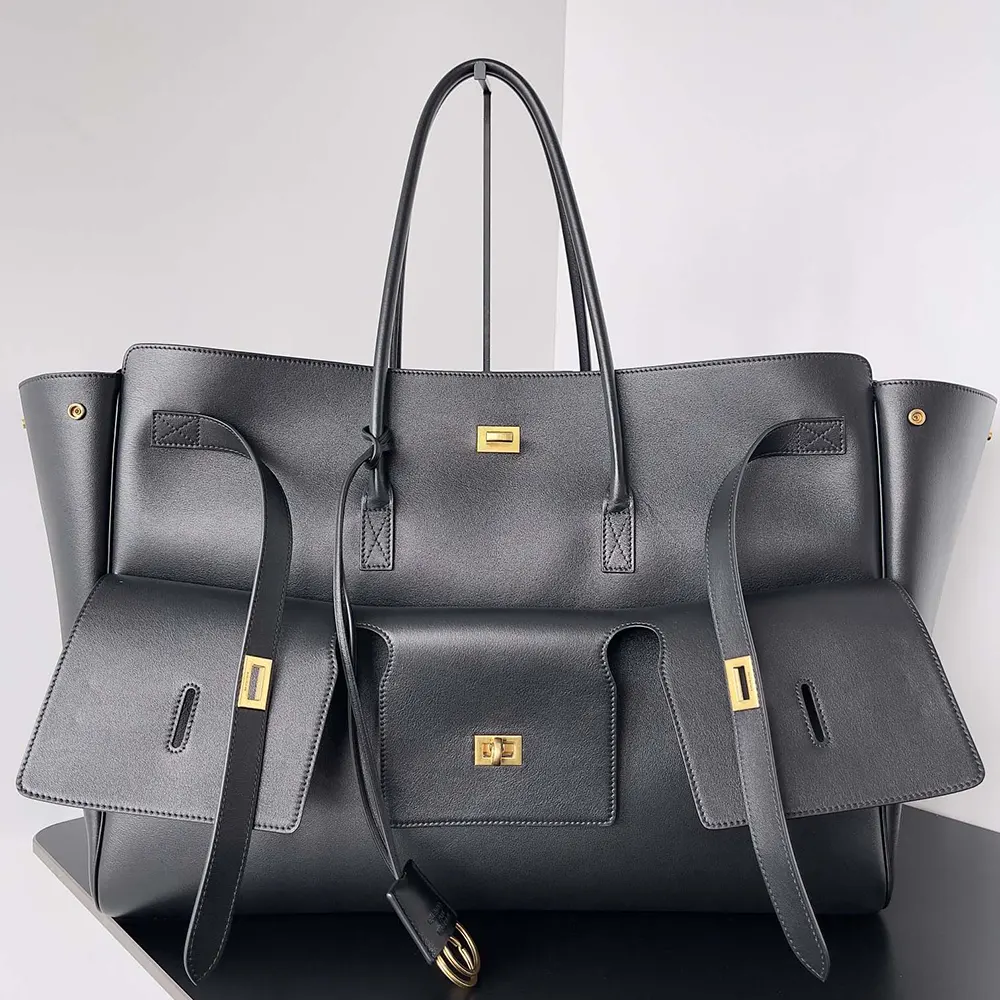 Close-up on gold hardware and smooth calfskin texture of Balenciaga Bel Air bag