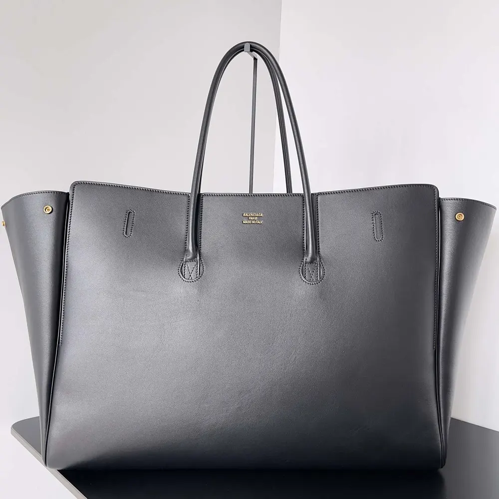 Side angle showing spacious XL silhouette of Balenciaga Women Bel Air XL Carry All Bag