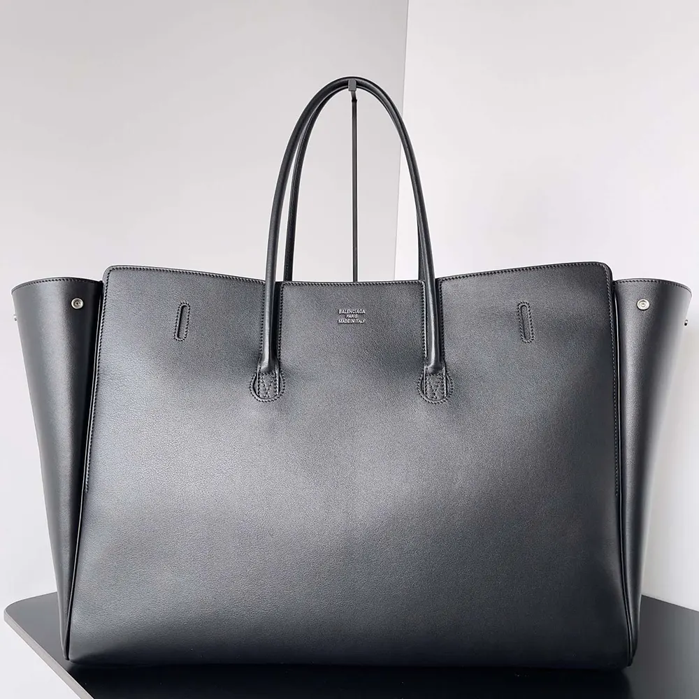 Side profile showing spacious silhouette of Balenciaga Women Bel Air XL Carry All Bag