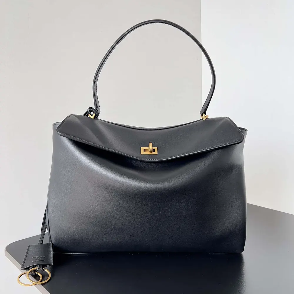 Close-up on silver-tone hardware and grained leather of Balenciaga Women Rodeo Medium Handbag
