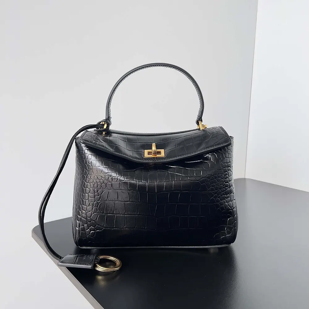 Close-up of gold-tone engraved hardware on Balenciaga Women Rodeo Mini Handbag