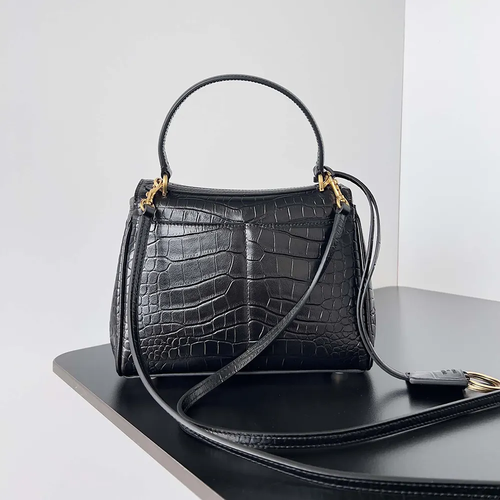 Side view showing slim silhouette of Balenciaga Women Rodeo Mini Handbag black leather