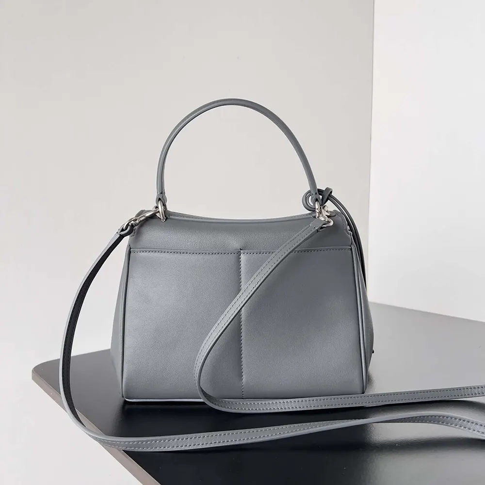 Side angle showcasing compact silhouette of Balenciaga Women Rodeo Mini Handbag