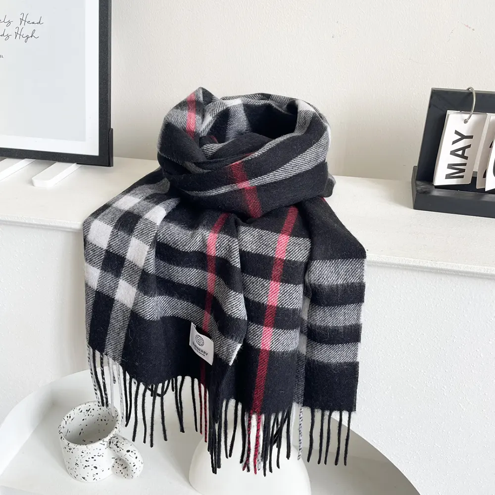 Close-up detail of Burberry check pattern on cashmere scarf