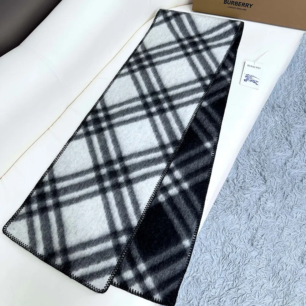 Styled flat display of Burberry Unisex Check Wool Scarf-Black fabric texture
