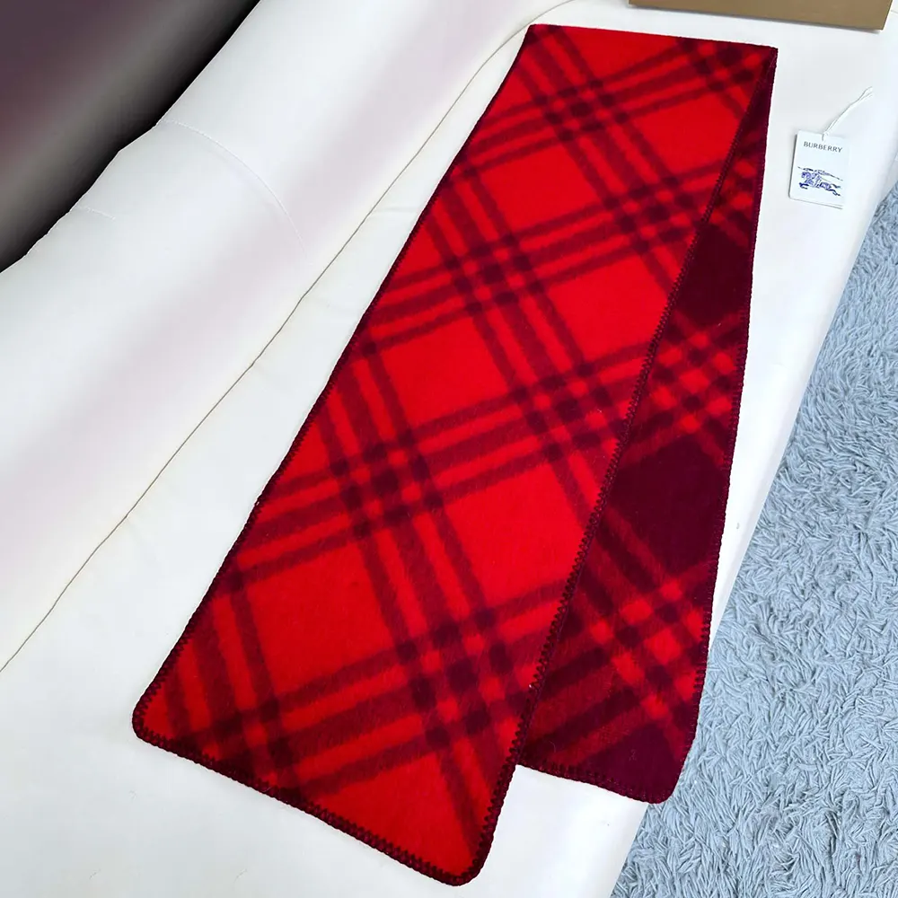 Folded Burberry Unisex Check Wool Scarf-Red highlighting vibrant red color