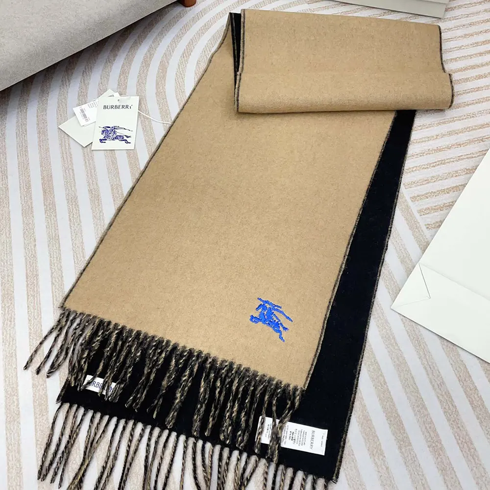 Close-up of soft cashmere fibres and Burberry logo on scarf