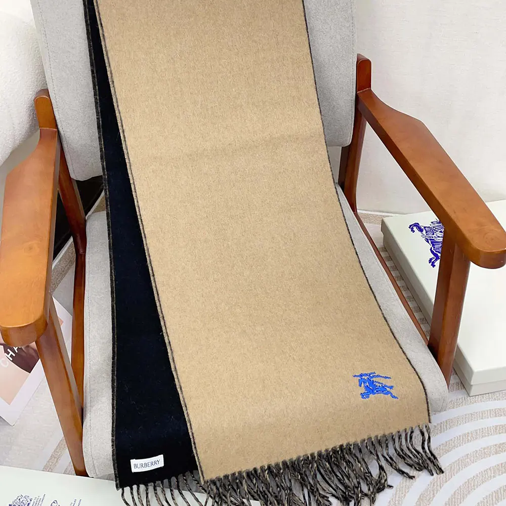 Side angle showing reversible beige colours of Burberry cashmere scarf