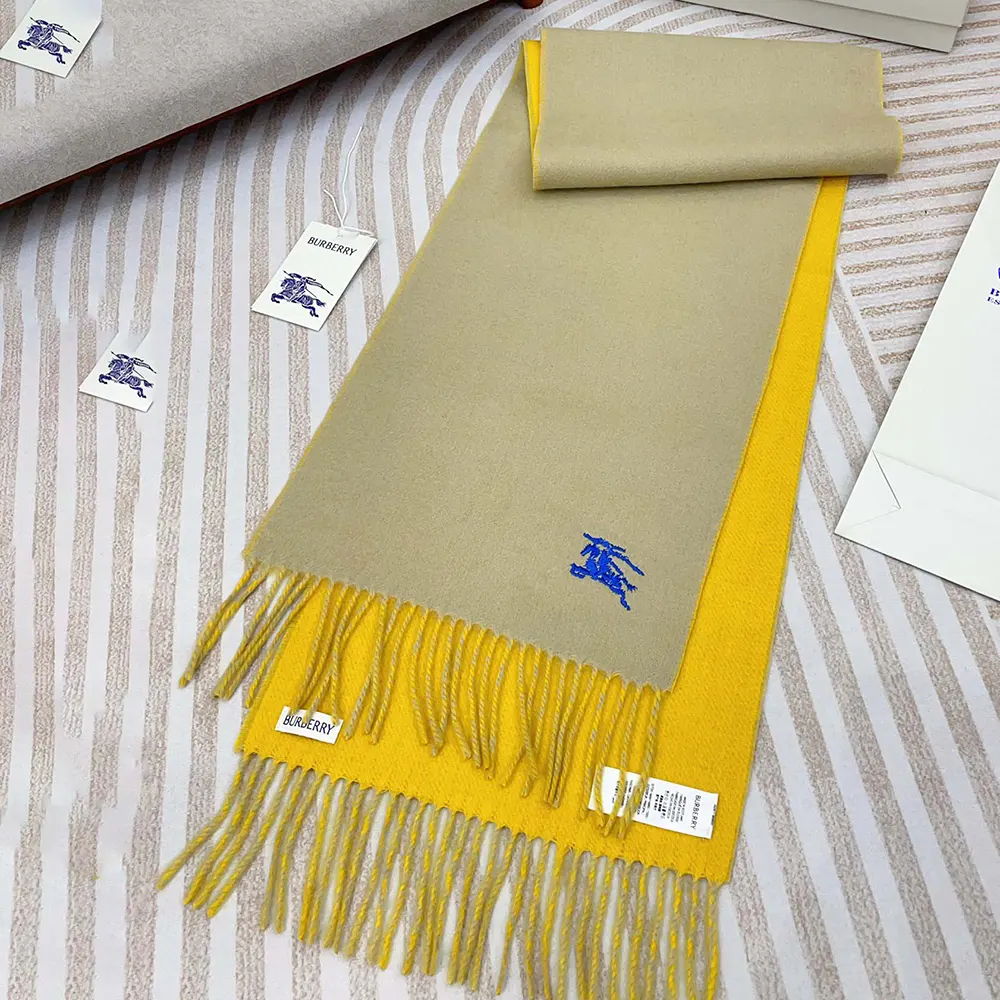 Close-up of Burberry scarf cashmere texture and yellow fabric
