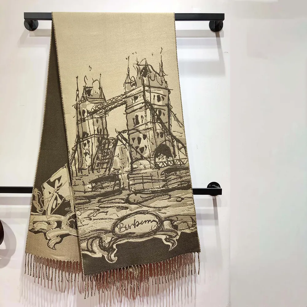 Close-up detail of woven Tower Bridge motif on cashmere scarf