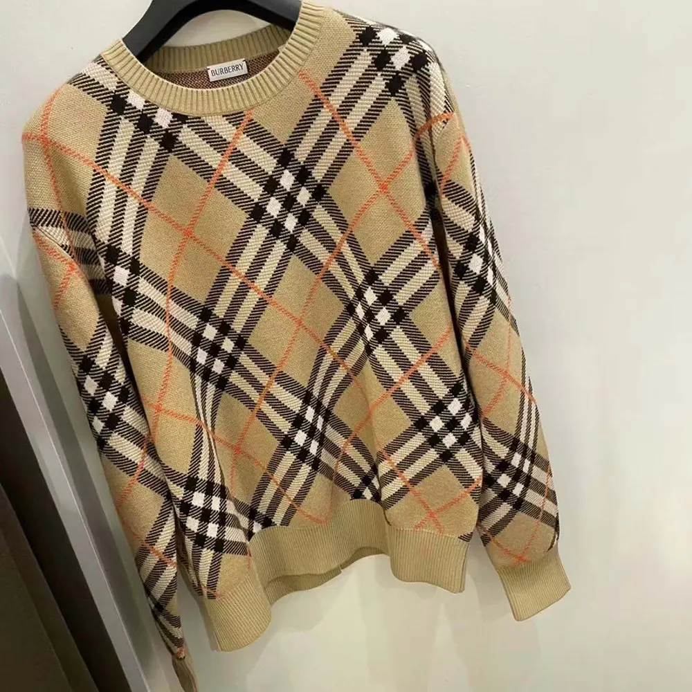 Side profile showing relaxed fit of Burberry Women Check Wool Blend Sweater