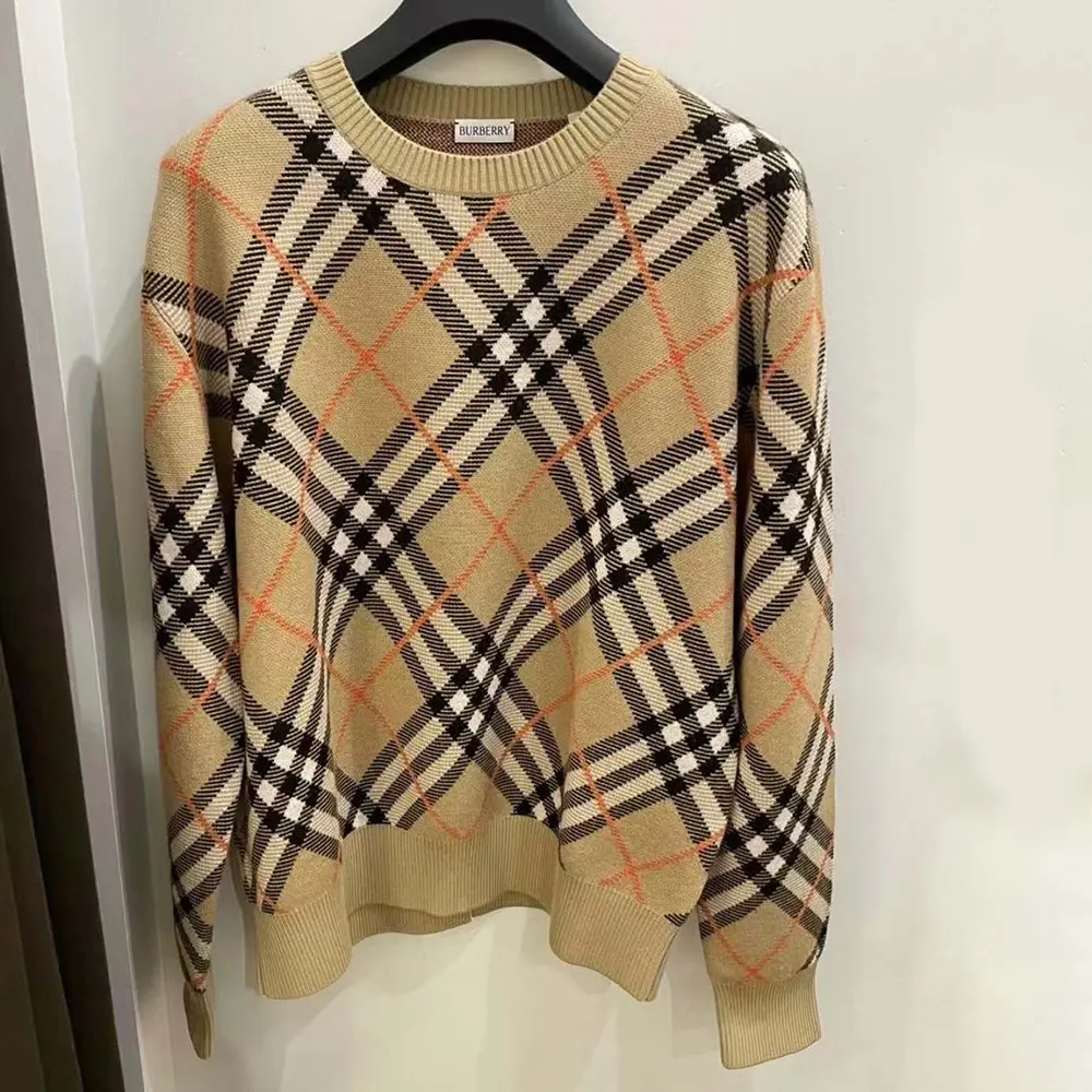 Close-up detail of Burberry check pattern on wool blend sweater