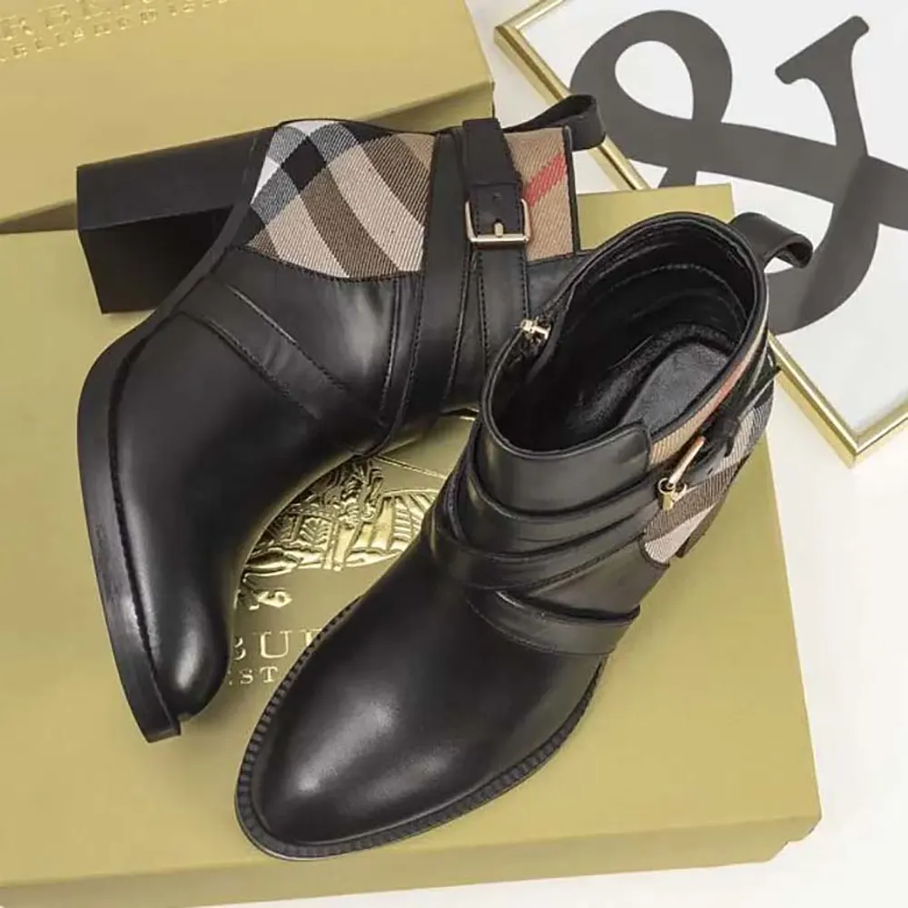 Side view showcasing heel and zipper on Burberry ankle boots