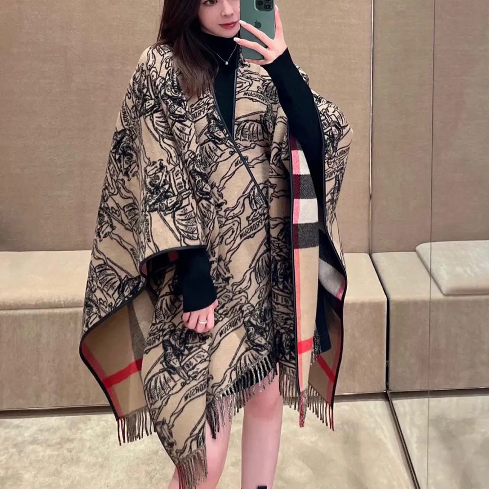 Side angle showing flowing silhouette of Burberry Women Reversible EKD Check Wool Cape-Brown