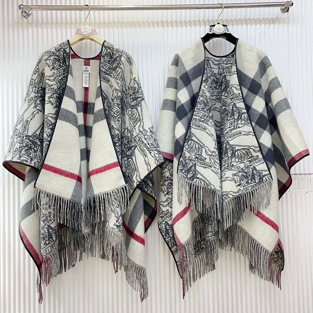 Side angle showing Burberry logo hardware on reversible wool cape