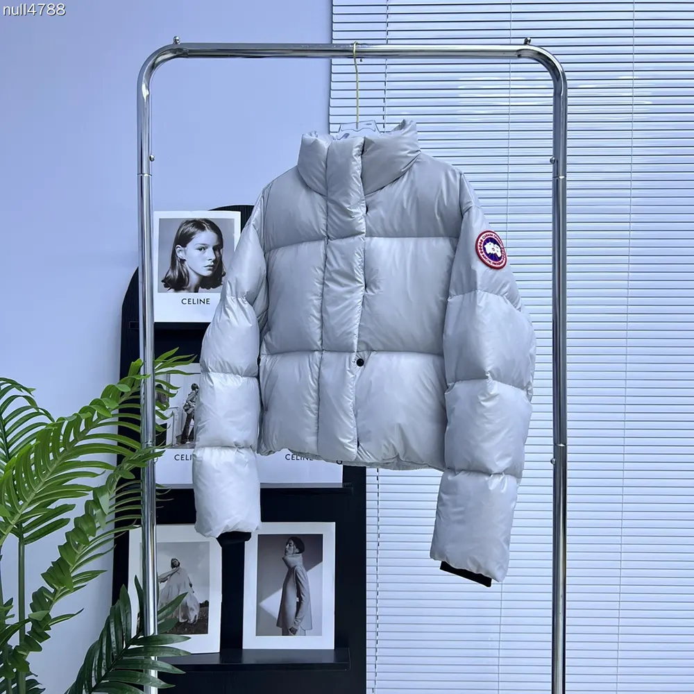 Close-up of Canada Goose signature badge on Cypress Cropped Puffer sleeve