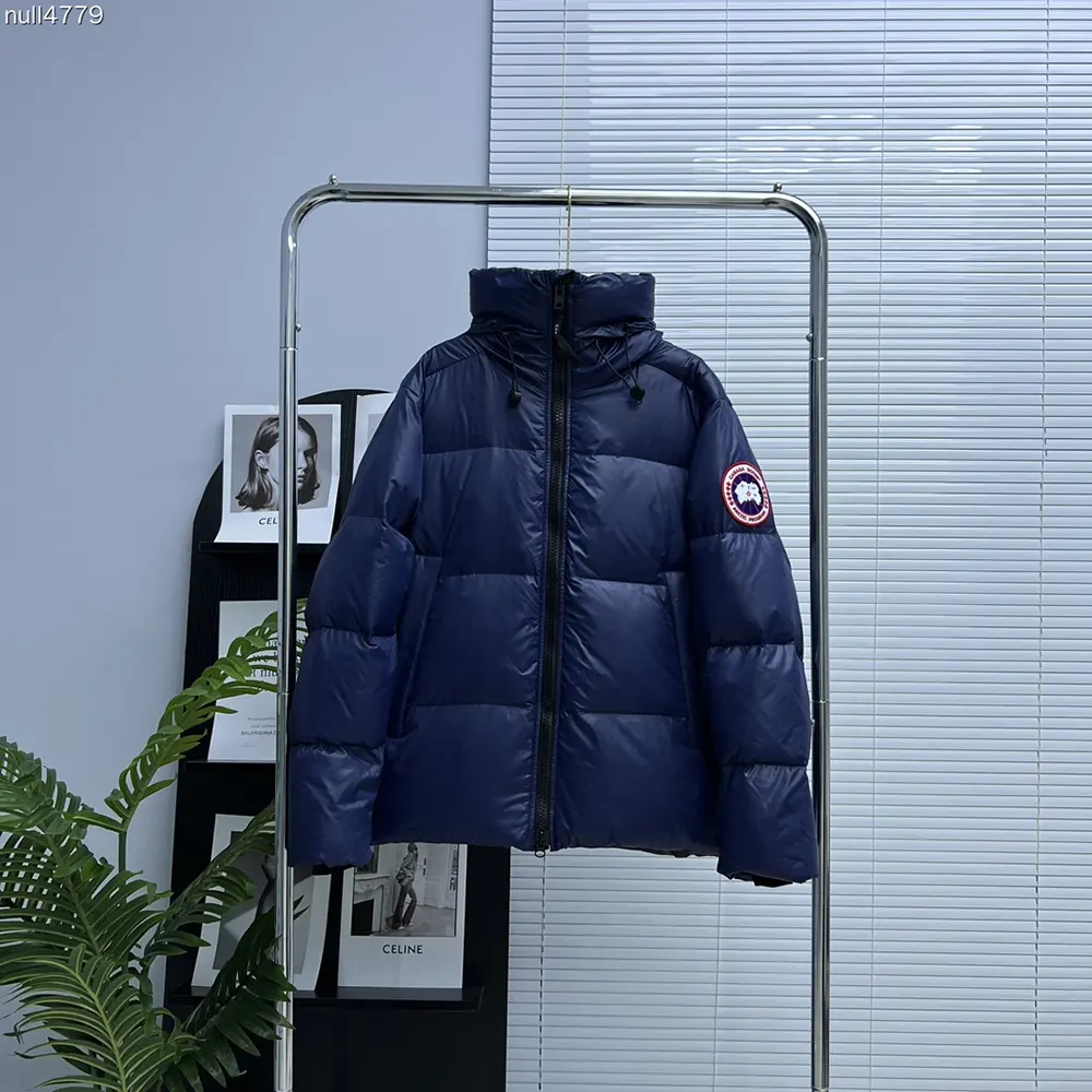 Close-up of zipper and Canada Goose logo on navy Cypress Puffer