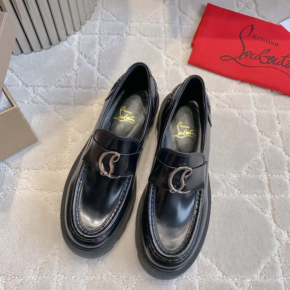 Top angle showing moccasin silhouette of Christian Louboutin CL Moc Lug Loafers in black
