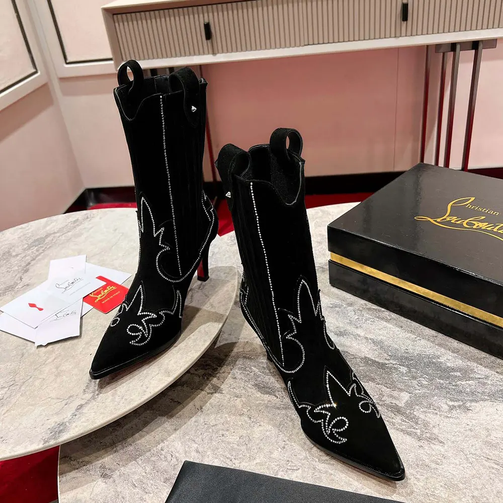 Top view showing heel and red sole of Christian Louboutin Santigag boots