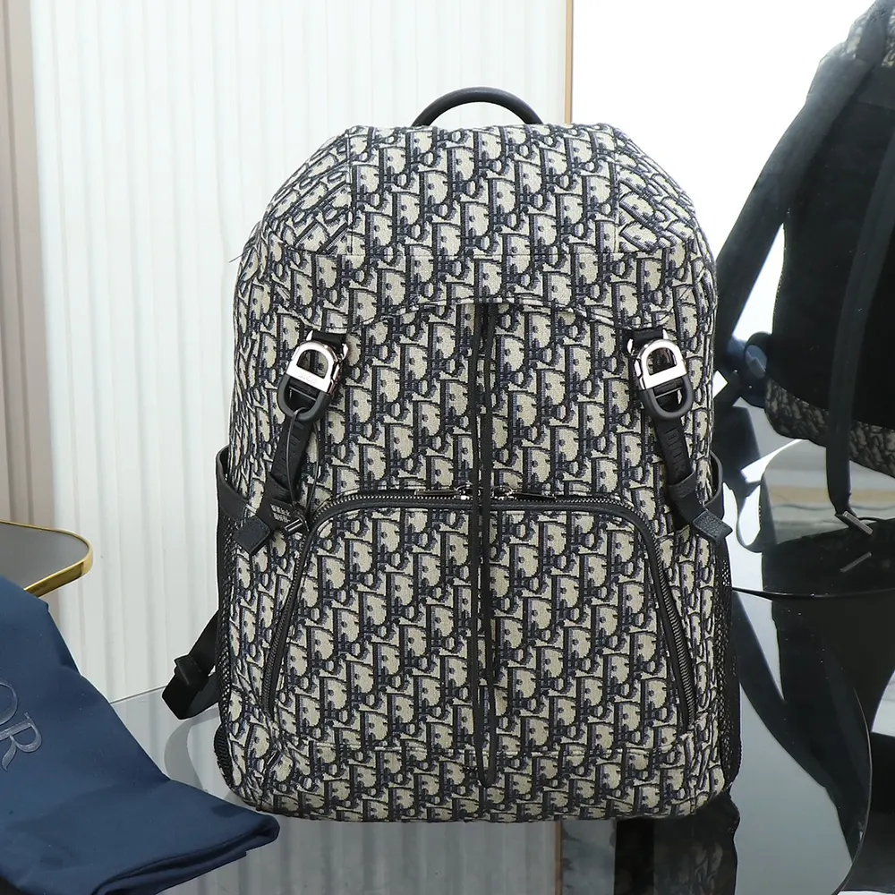 Close-up of flap closure and silver-tone hardware on Dior Men Dior 8 Backpack