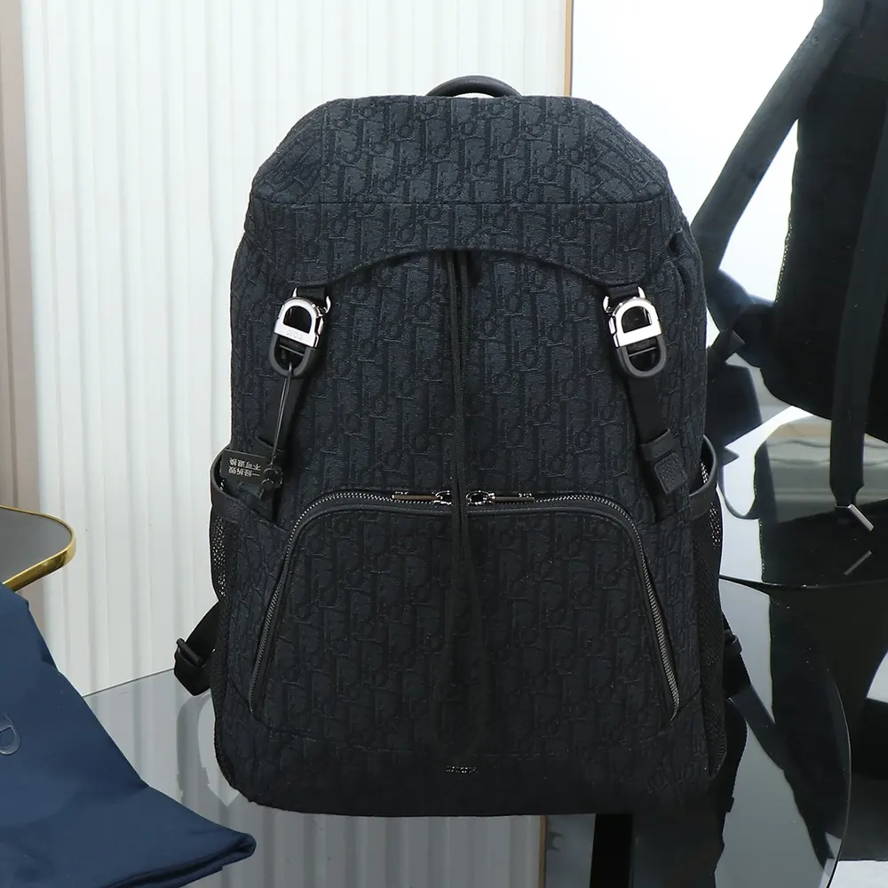 Close-up of flap closure and gunmetal hardware on Dior Men Dior 8 Backpack