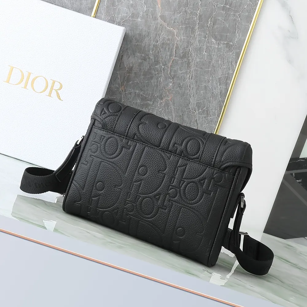 Side view showing matte black hardware and adjustable strap on Dior bag