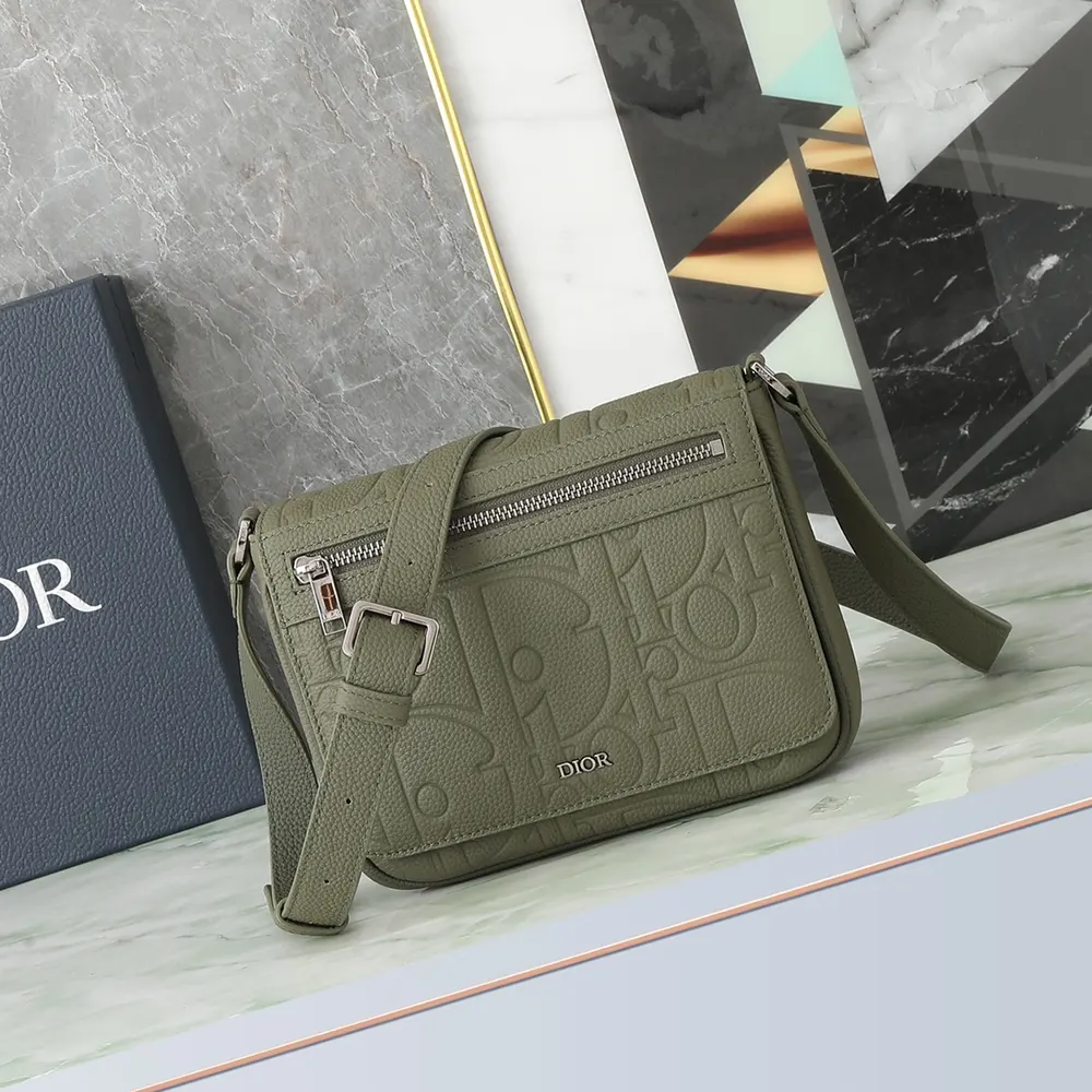 Close-up of silver-tone hardware on Dior Men Messenger Bag flap