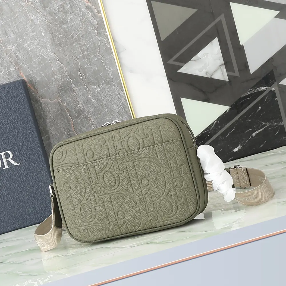 Side angle showing adjustable strap and leather texture of Dior Men Rider 2.0