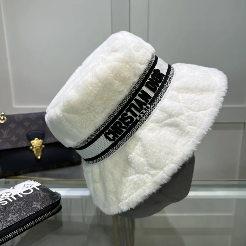 Close-up of white shearling and Cannage quilting on Dior bucket hat