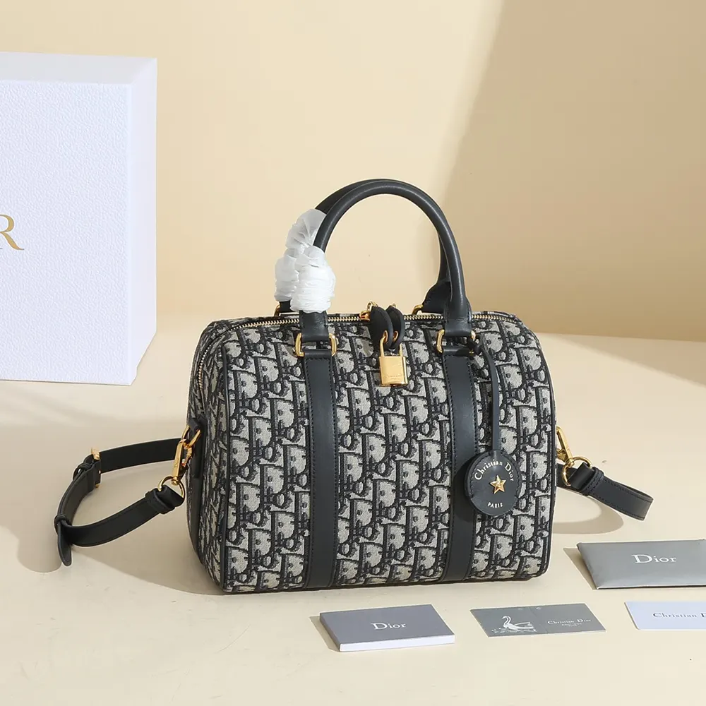 Close-up of silver clasp and blue jacquard texture on Dior Groove 25 Bag