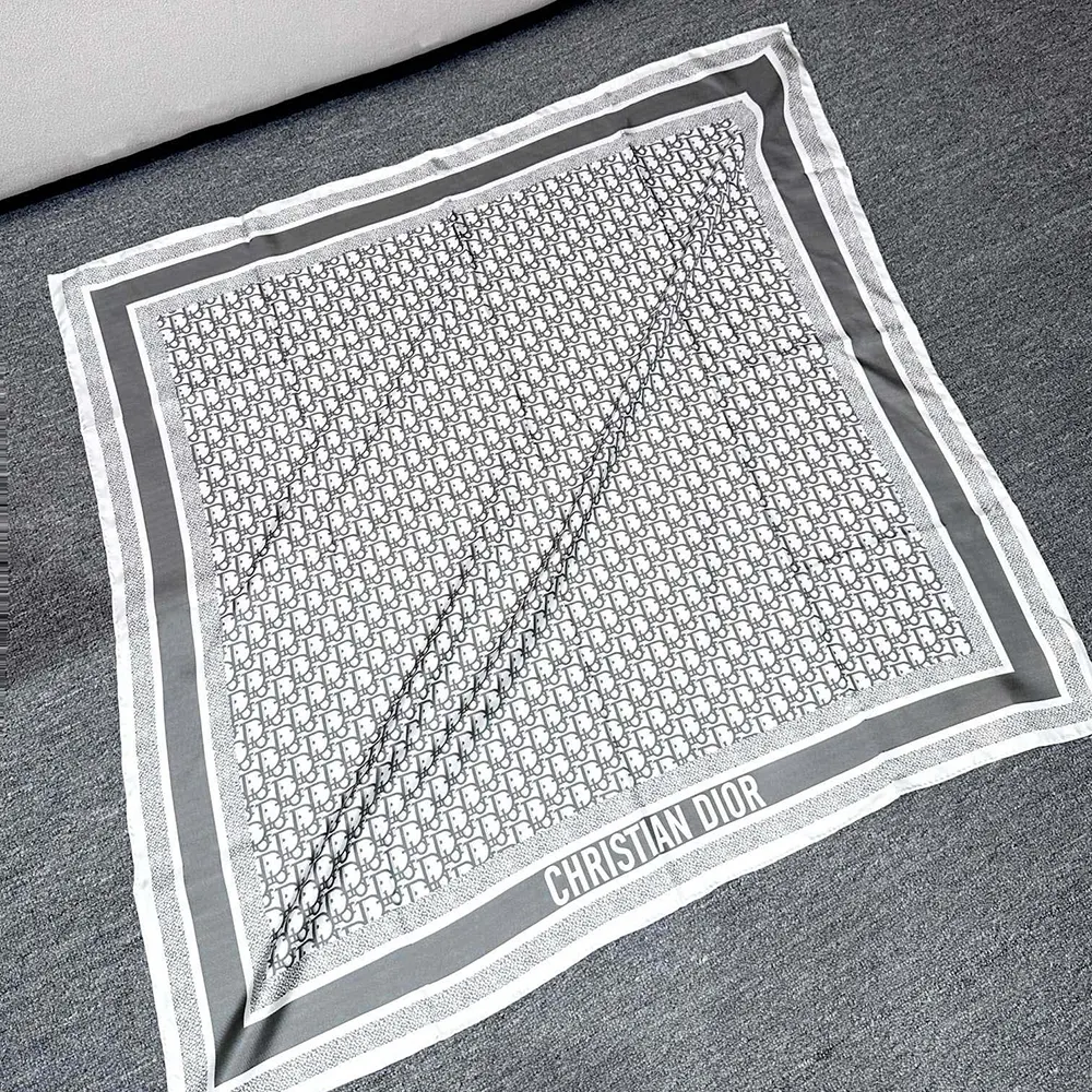 Close-up of signature Dior Oblique pattern on the silk twill scarf