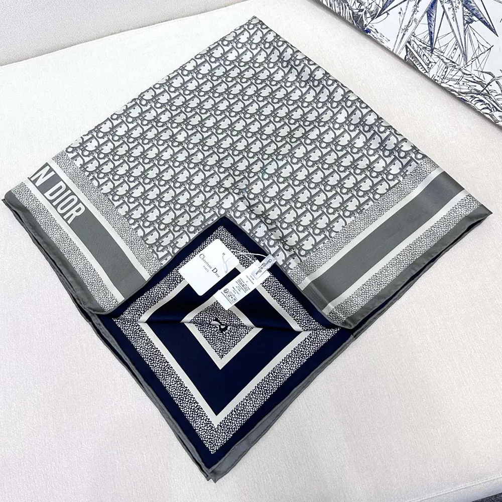 Close-up of signature Dior Oblique pattern on Dior Unisex Diortwin scarf