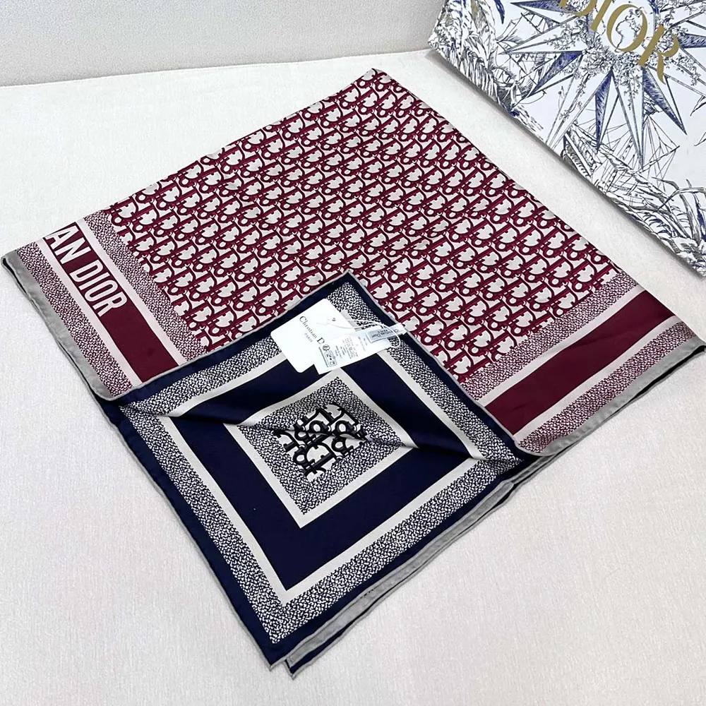 Flat lay showing burgundy and navy blue Dior Unisex Dior Oblique Diortwin 90 Square Scarf