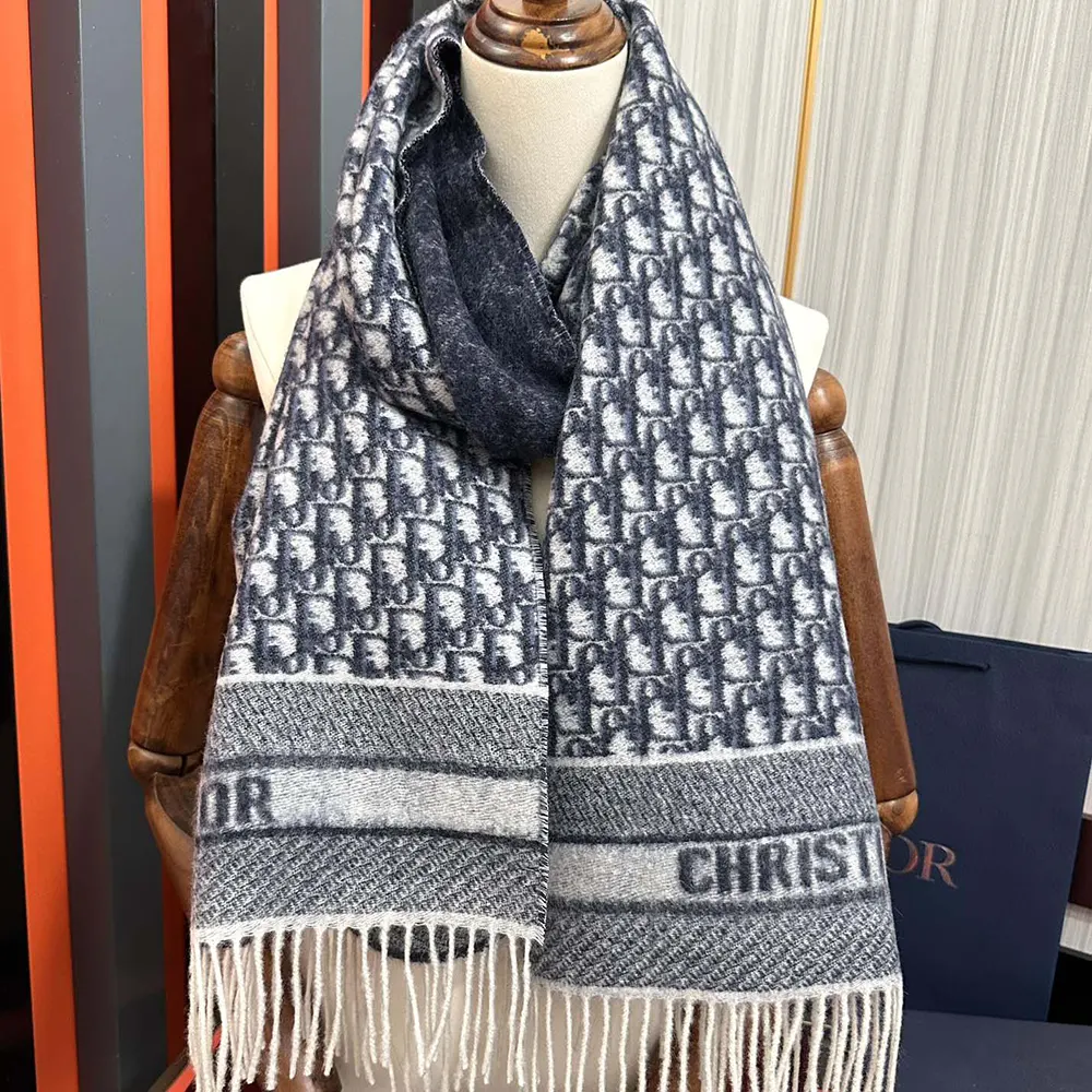 Close-up of Dior Oblique pattern woven in navy and ecru cashmere scarf