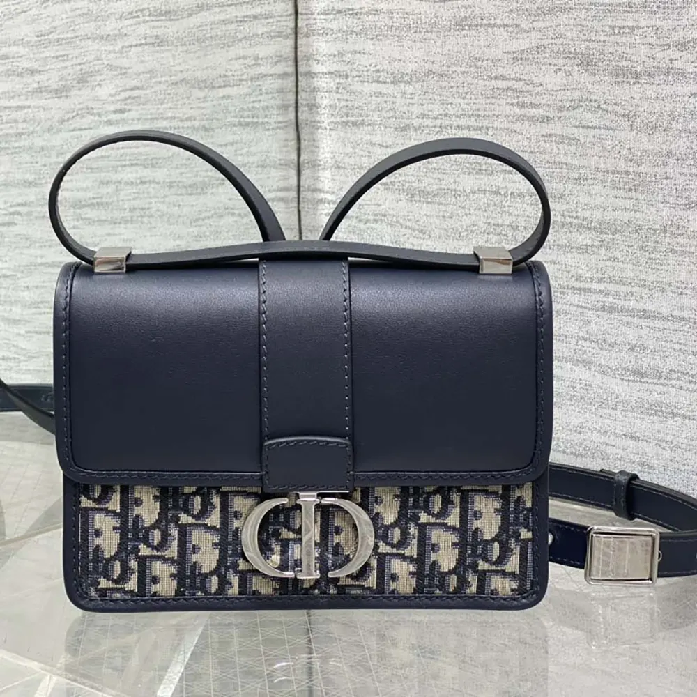 Side angle showing texture details on Dior Women 30 Montaigne Bag blue jacquard