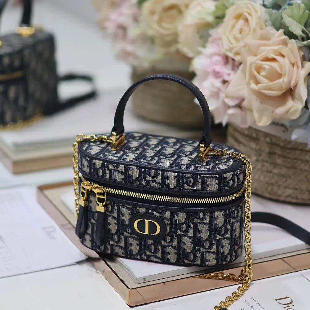 Side profile showing zipper and strap of Dior Women 30 Montaigne Mini Vanity Case