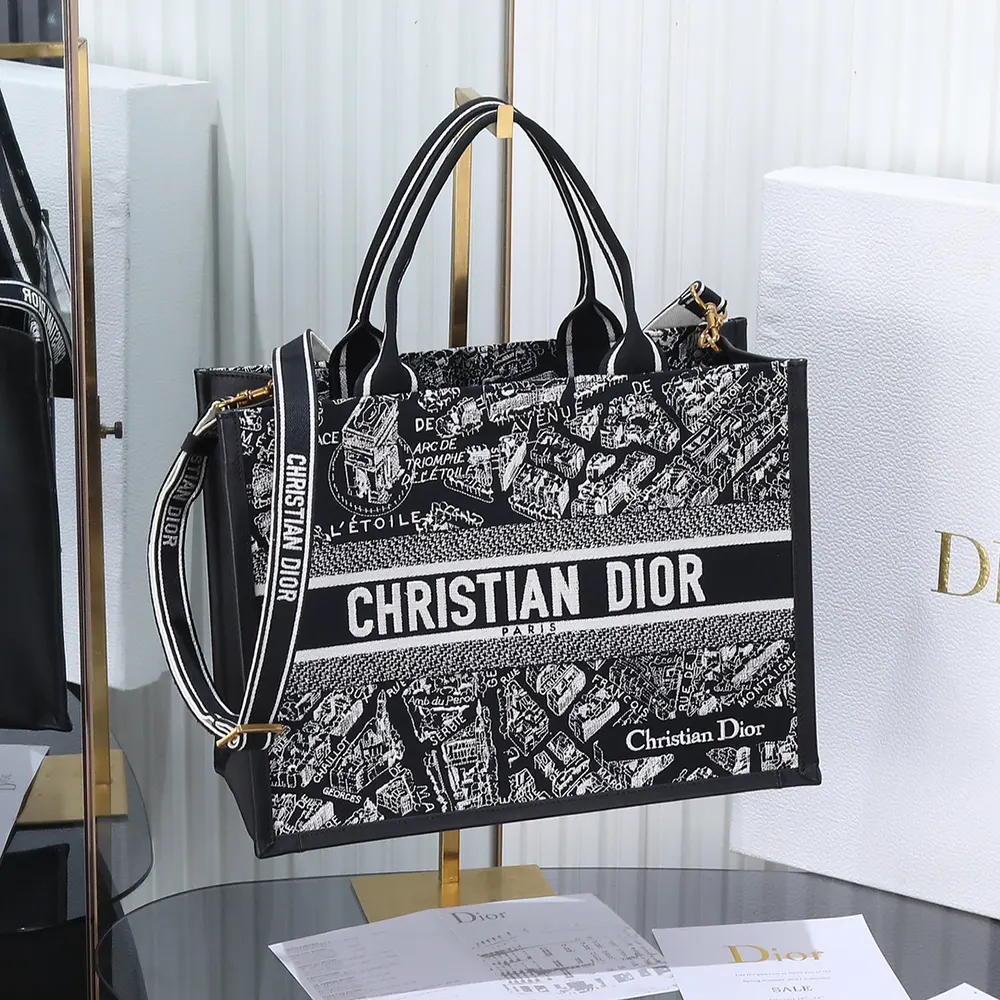 Close-up of black calfskin and white embroidery on Dior Women Medium Dior Book Tote