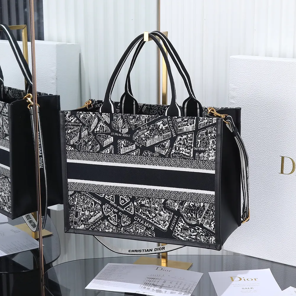 Side angle showing structured silhouette of Dior Women Medium Dior Book Tote Black and White