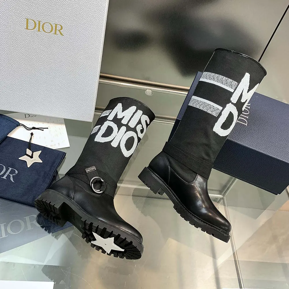 Close-up on white Miss Dior graffiti detail on boot upper