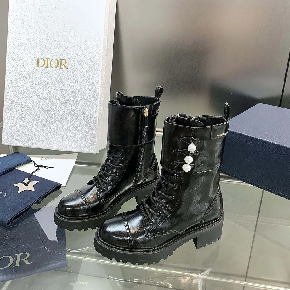 Back angle showing silver Dior hardware on D-Strike ankle boot