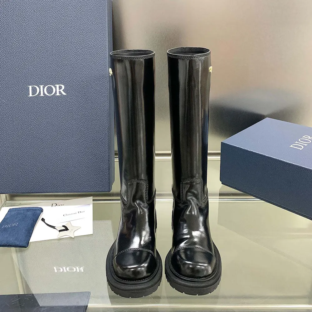 Close-up of brushed calfskin texture and Dior logo hardware on boot