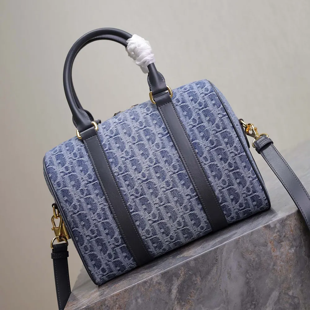 Side angle showcasing strap and groove silhouette of Dior Women Groove 25 Bag