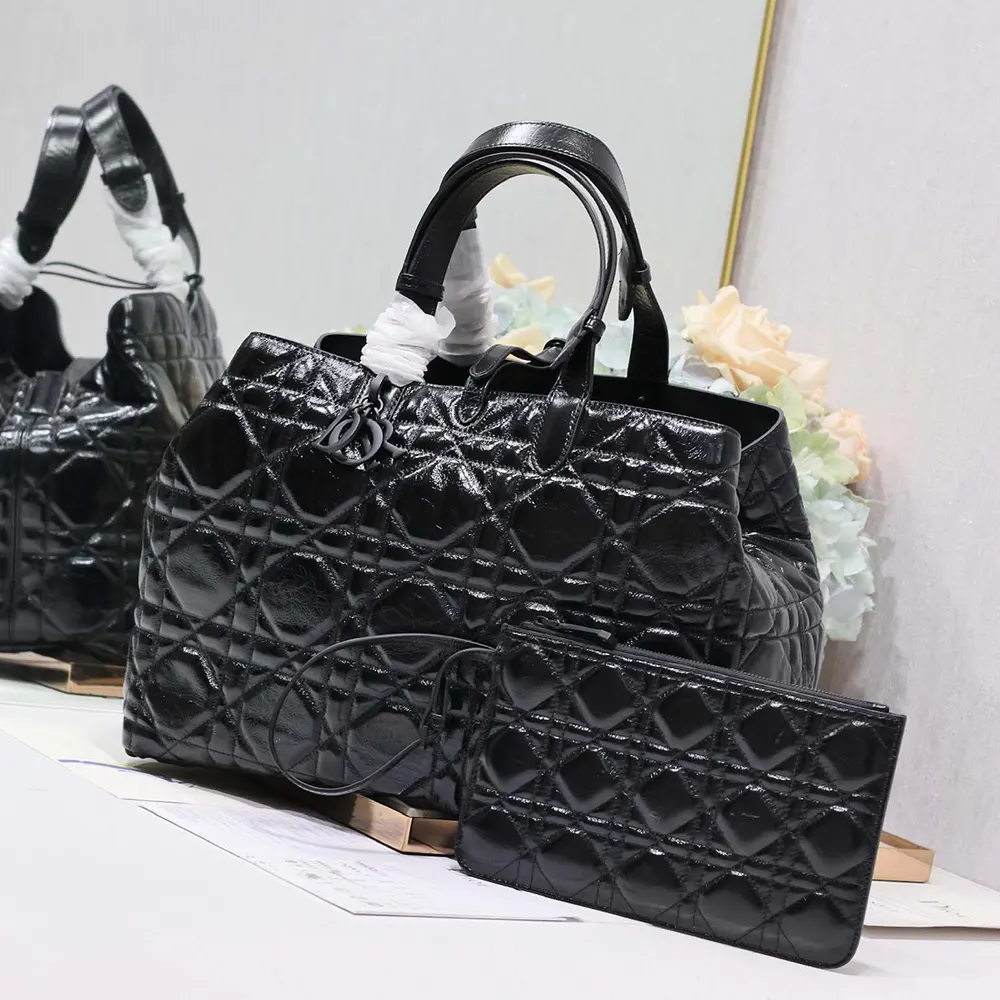 Side angle showing depth of Dior Women Large Dior Toujours Bag in black