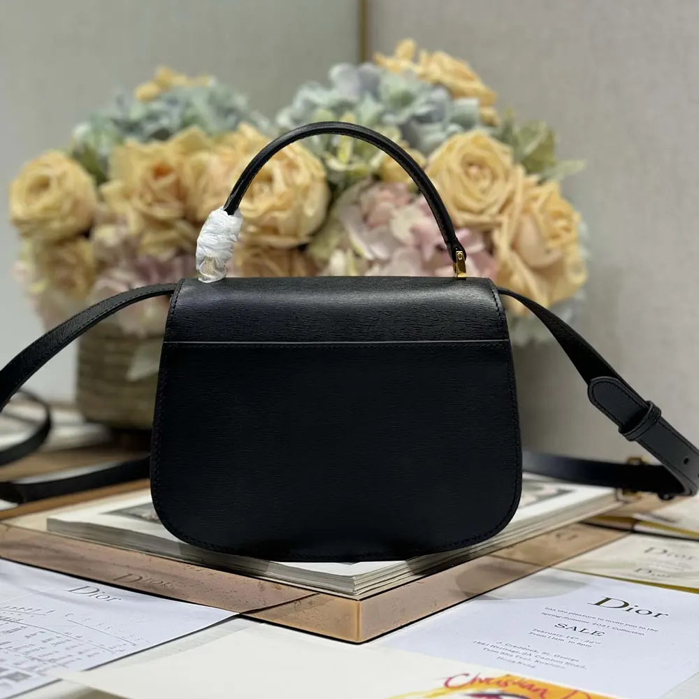 Side angle showing structured silhouette of Dior Women Medium 30 Montaigne Avenue handbag