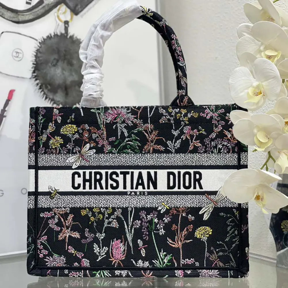 Close-up detail of black embroidery and multicolor unicorn on Dior Women Medium Dior Book Tote