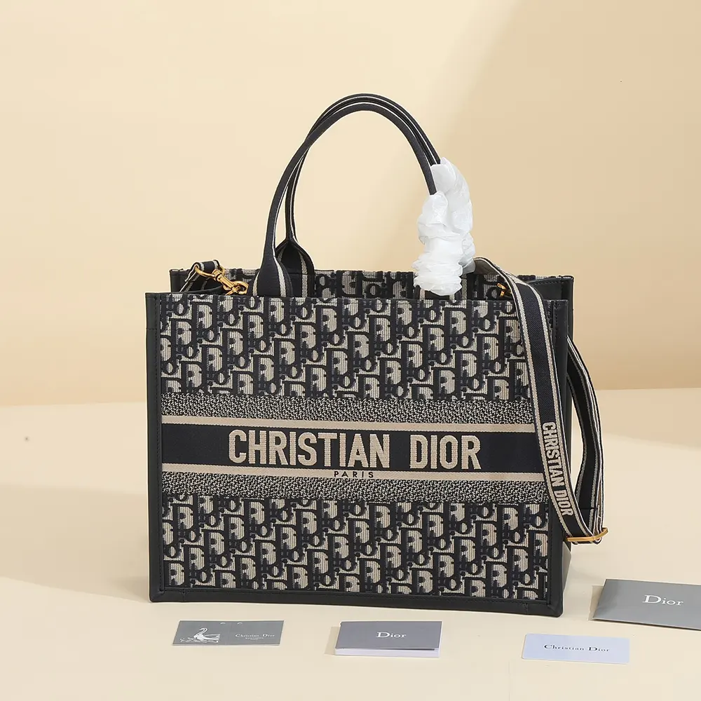 Close-up of navy calfskin and signature Dior Oblique embroidery detail