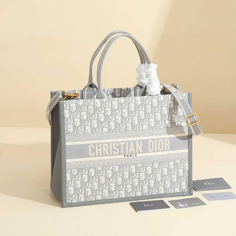 Close-up of gray Dior Oblique embroidery and calfskin leather texture