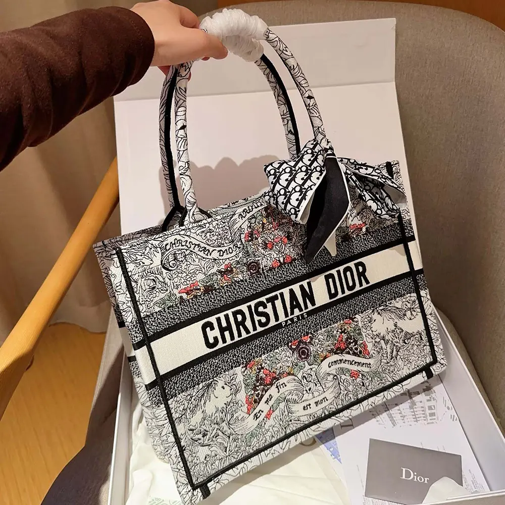 Side angle showing silver-tone hardware on Dior Women Medium Dior Book Tote