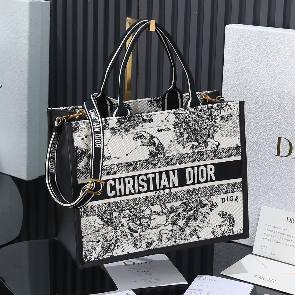 Close-up of zodiac embroidery on black calfskin Dior tote