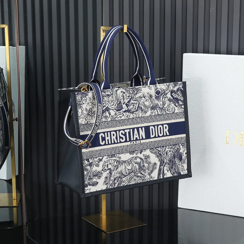 Close-up of toile de Jouy embroidery on Dior Women Medium Dior Book Tote